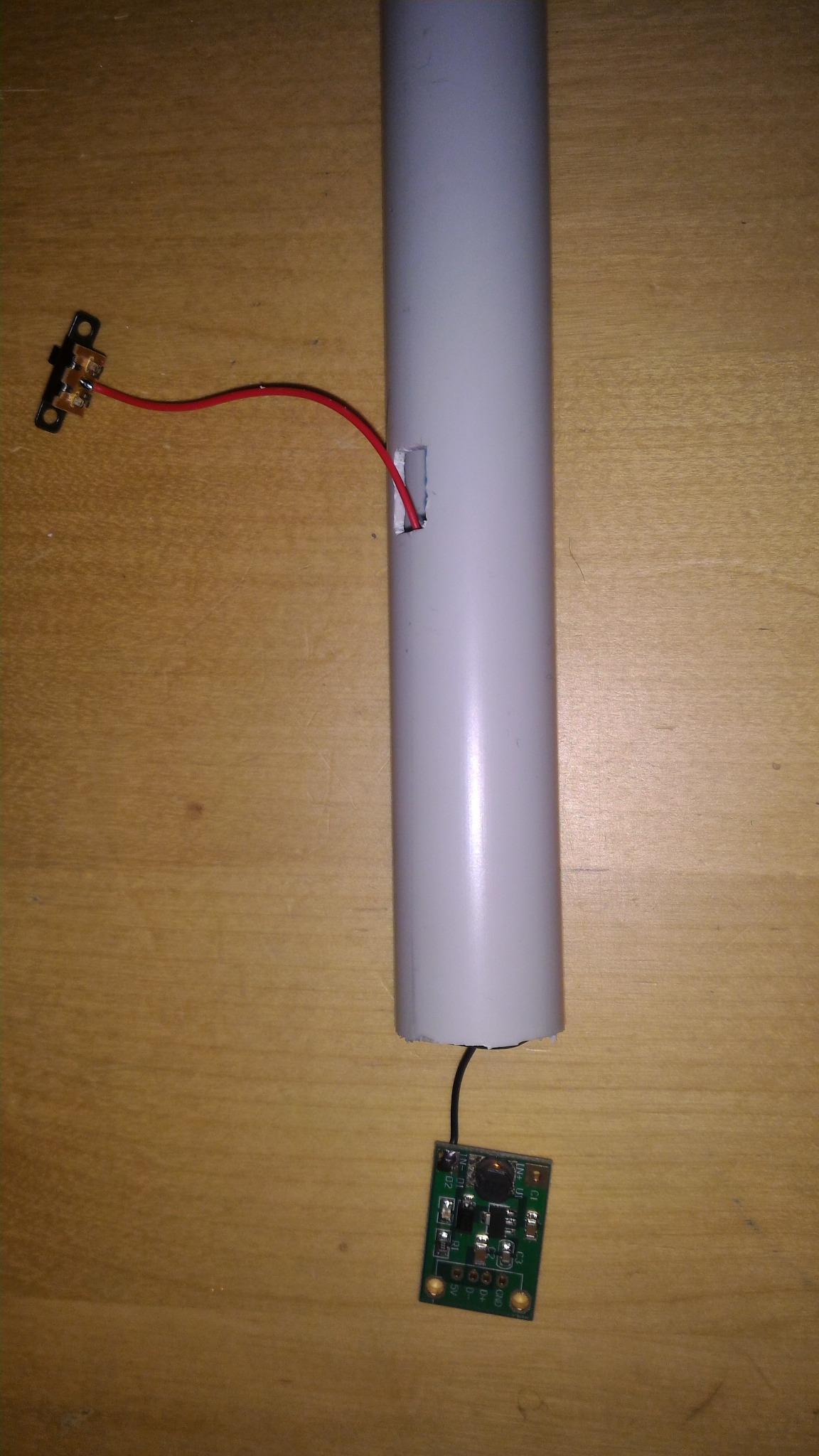 Boost converter and switch wiring being routed into the body